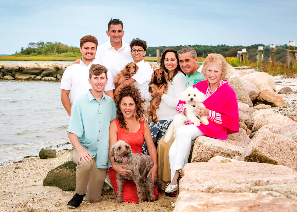 Multi-generational family portrait with pet dogs on the beach, Massachusetts family photographer