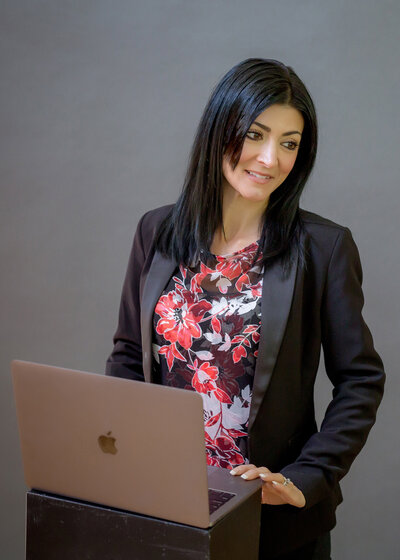 Small business entrepreneur working on a laptop, personal branding portrait in South Shore MA
