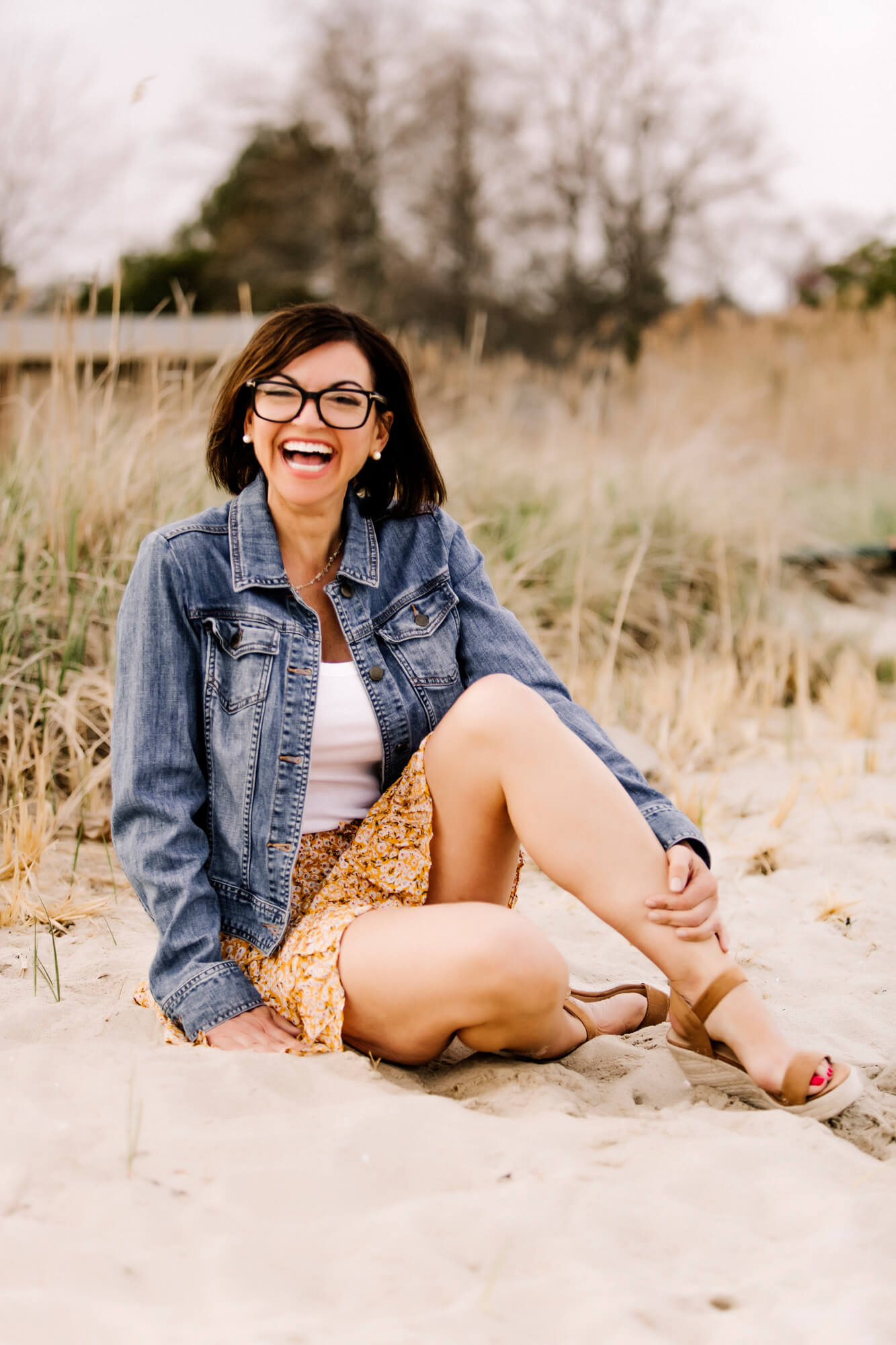 Woman laughing candidly on a South Shore MA beach during a dating profile photography session
